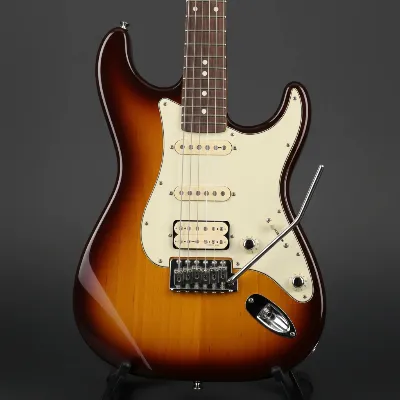 Detailed view of a Yamaha Pacifica 112V electric guitar highlighting its key components: body, neck, headstock, pickups, bridge, and control knobs. The guitar should be in a natural or sunburst finish, displayed on a stand from a slightly elevated angle with soft studio lighting. Focus on clear visibility of all parts.
